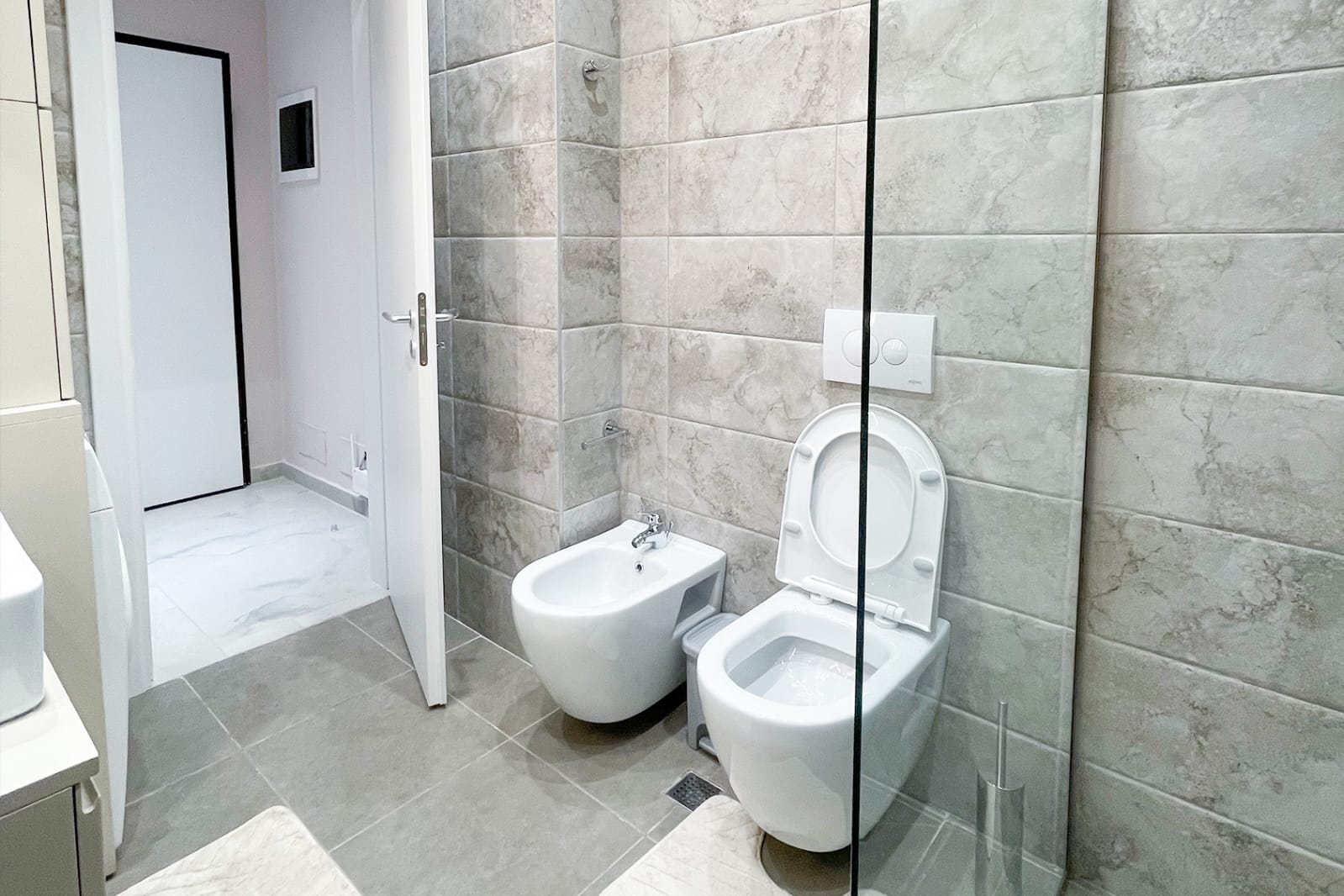 Bathroom — walk-in shower, toilet and bidet